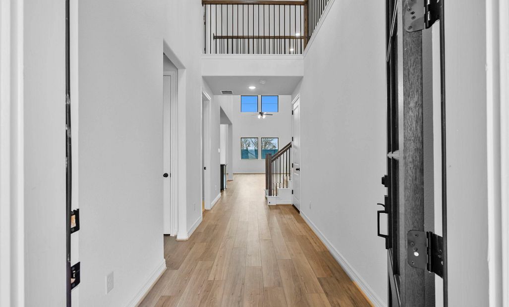 An inviting entryway leads you effortlessly into an open-concept living space designed for everyday