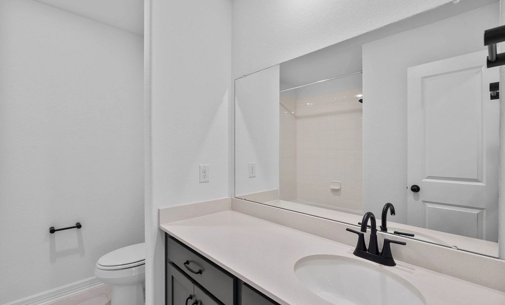Upstairs bathroom featuring beautiful matte black plumbing and cabinet pulls.