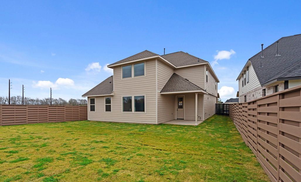 A generously sized backyard is ready to host friends and family.