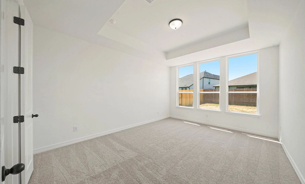 Primary bedroom. Sample product photo. Actual exterior and interior selections may vary by homesite.