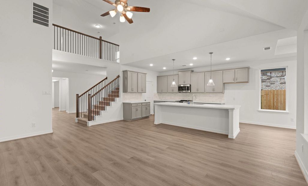 Gathering room and kitchen. Sample product photo. Actual exterior and interior selections may vary