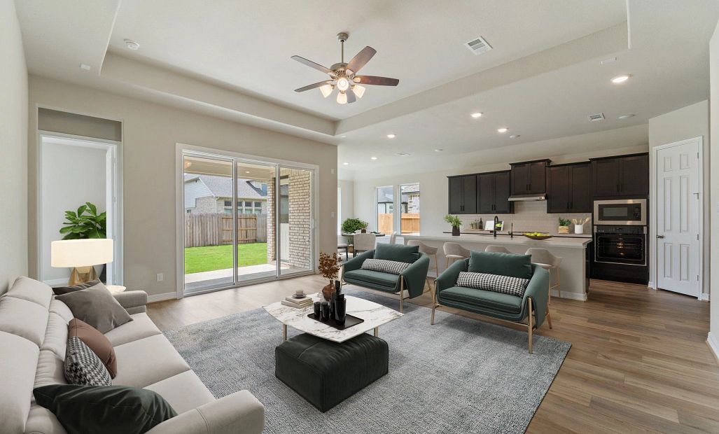 Open concept living space. Note: Sample product photo - actual exterior and interior selections may
