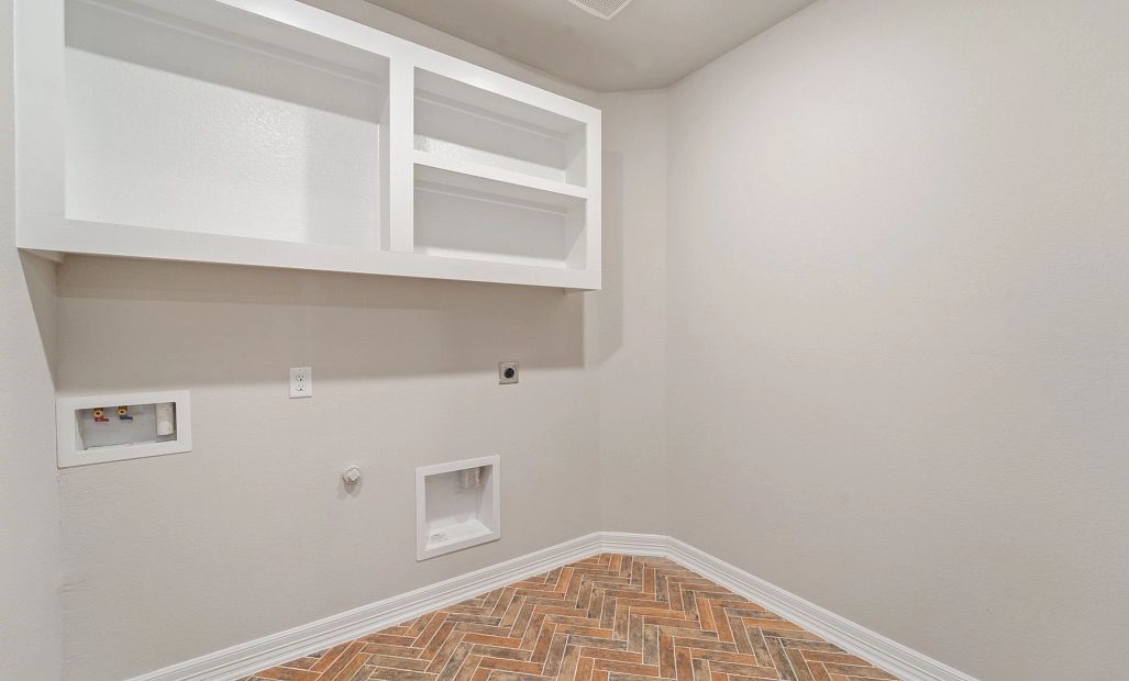 Utility room. Note: Sample product photo - actual exterior and interior selections may vary by