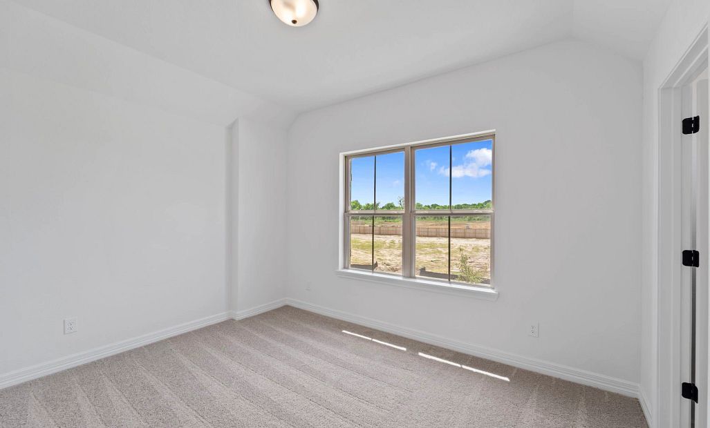 Fourth bedroom with private bath. Note: Sample product photo - actual exterior and interior