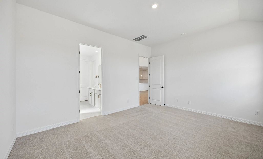 Primary bedroom. Sample product photo. Actual exterior and interior selections may vary by homesite.