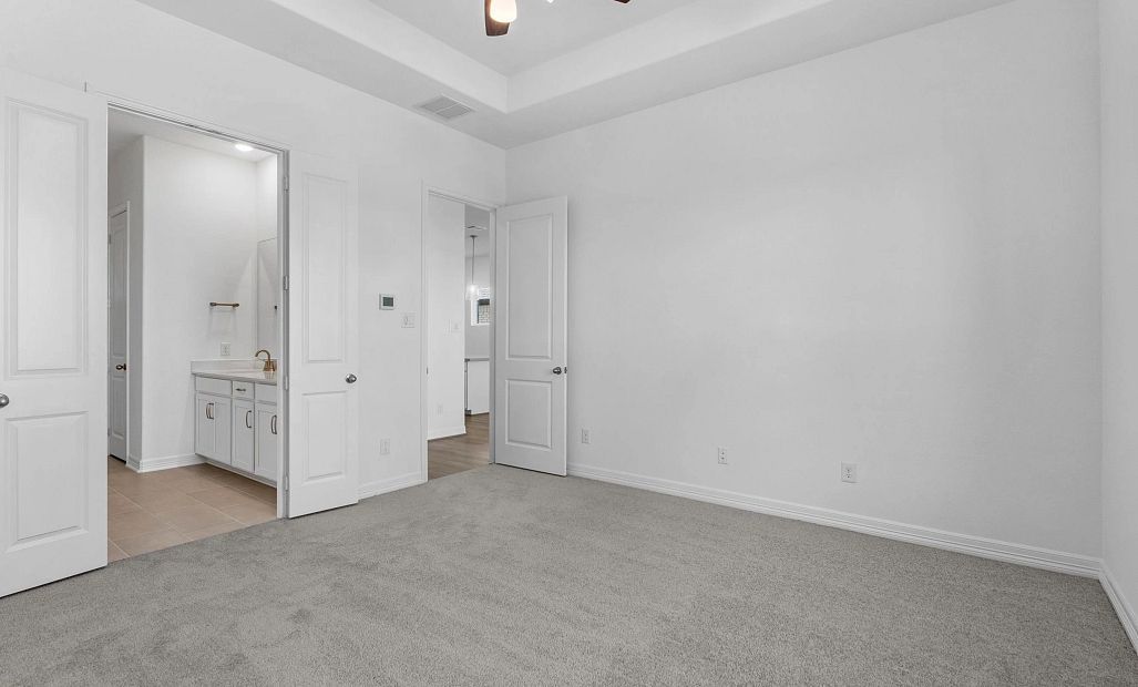 Primary bedroom. Sample product photo. Actual exterior and interior selections may vary by homesite.