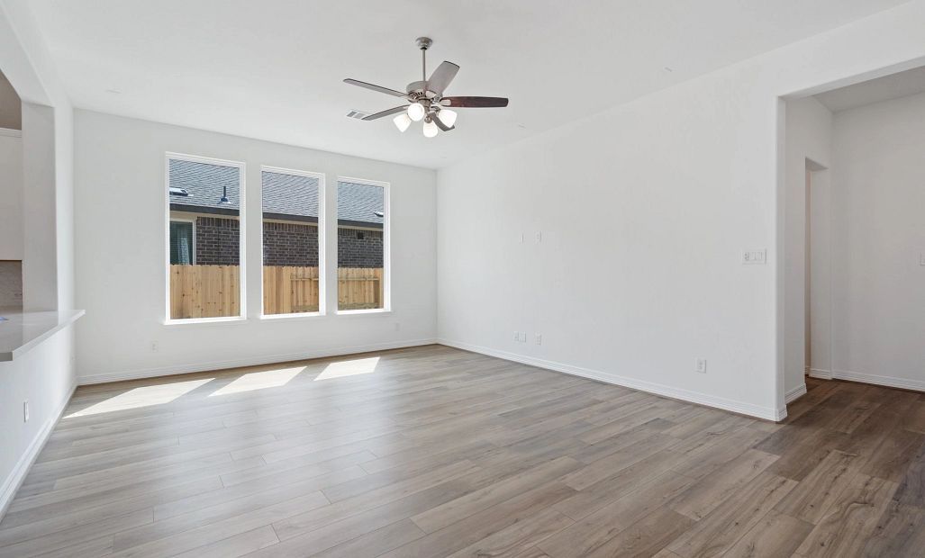 Gathering room. Sample product photo. Actual exterior and interior selections may vary by homesite.
