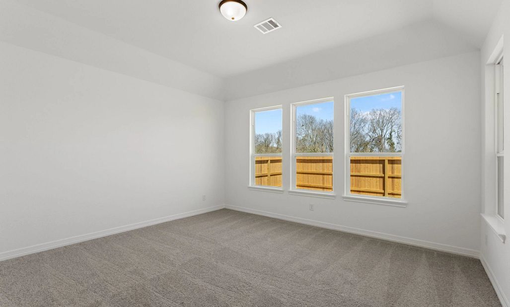 Primary bedroom. Sample product photo. Actual exterior and interior selections may vary by homesite.