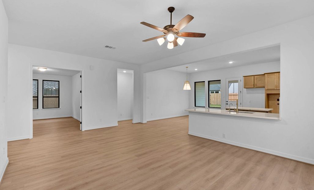 Gathering room. Sample product photo. Actual exterior and interior selections may vary by homesite.