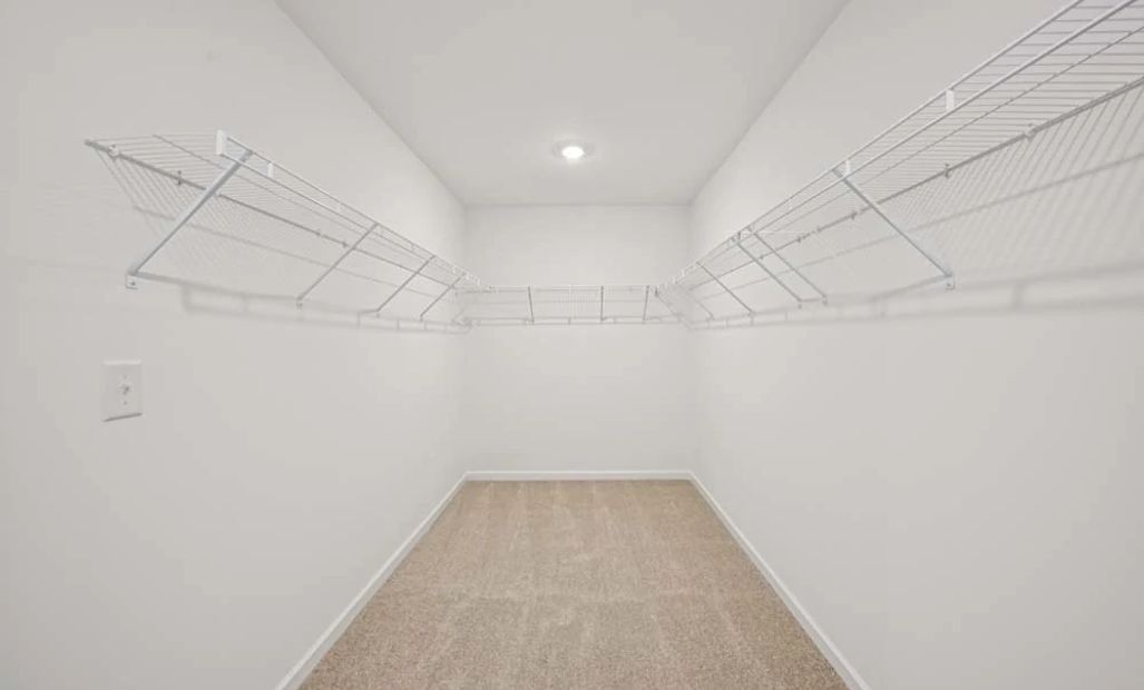 Representative Photo: Primary Bedroom Walk-In Closet