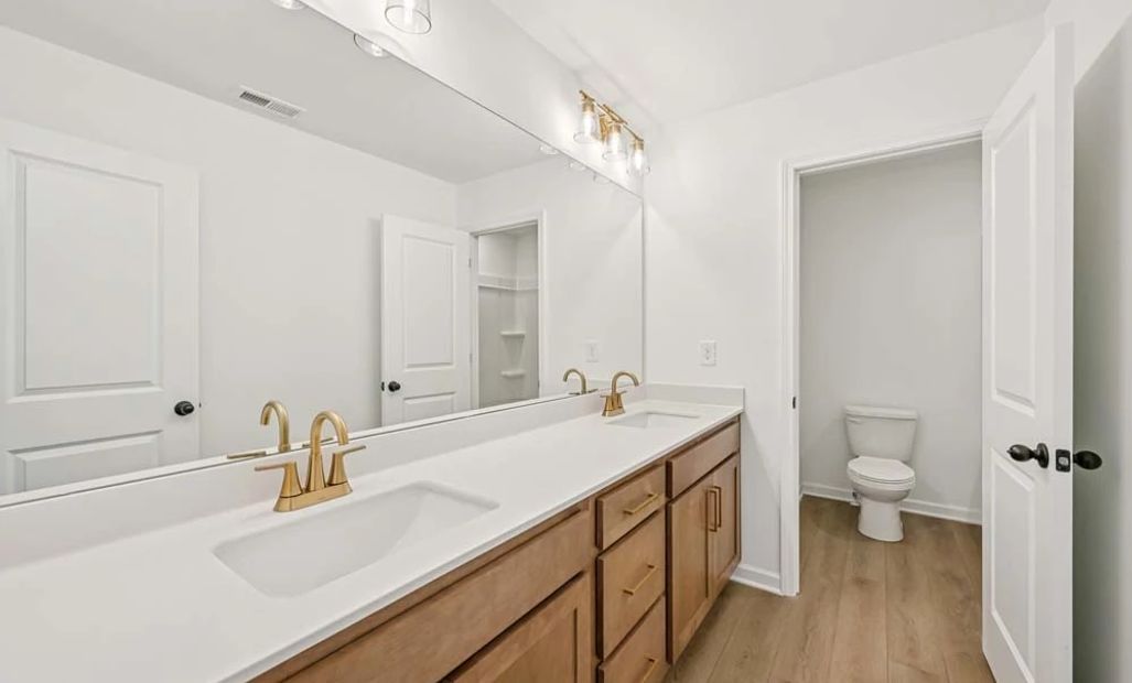 Representative Photo: Bathroom Two featuring Laguna Collection Finishes