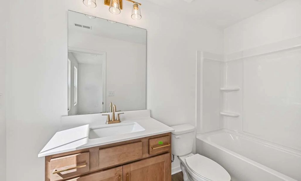 Representative Photo: Bathroom Three featuring Laguna Collection Finishes