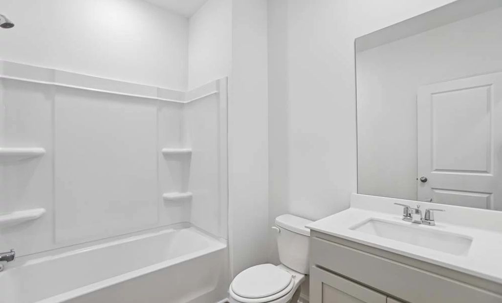 Representative Photo: Guest Bathroom featuring Artisan Collection Finishes