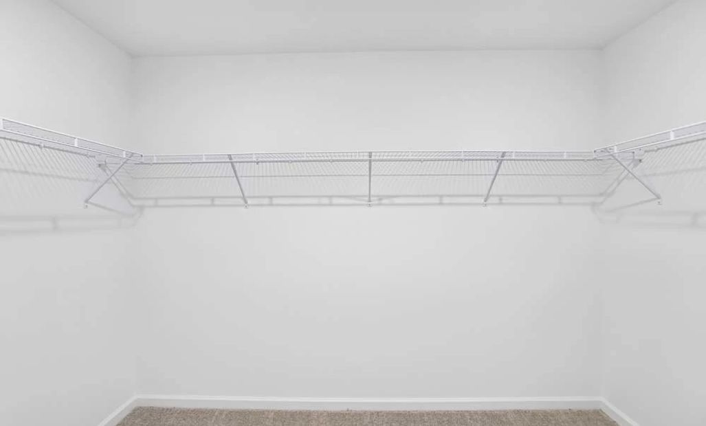 Representative Photo: Primary Bedroom Walk-In Closet