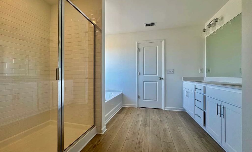 Sample Photo: Primary Bathroom featuring Coastal Collection Finishes