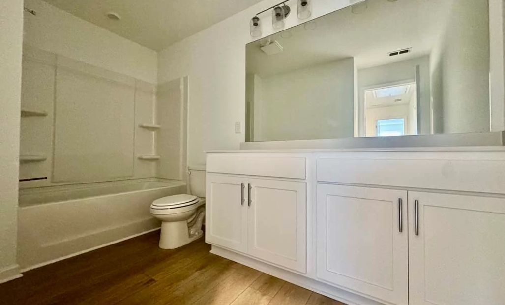 Sample Photo: Bathroom Two featuring Coastal Collection Finishes