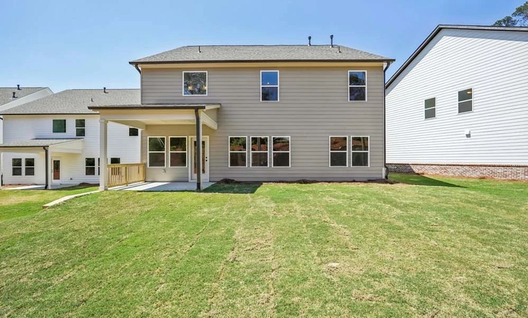 Sample Photo: Rear Exterior Featuring Covered Patio