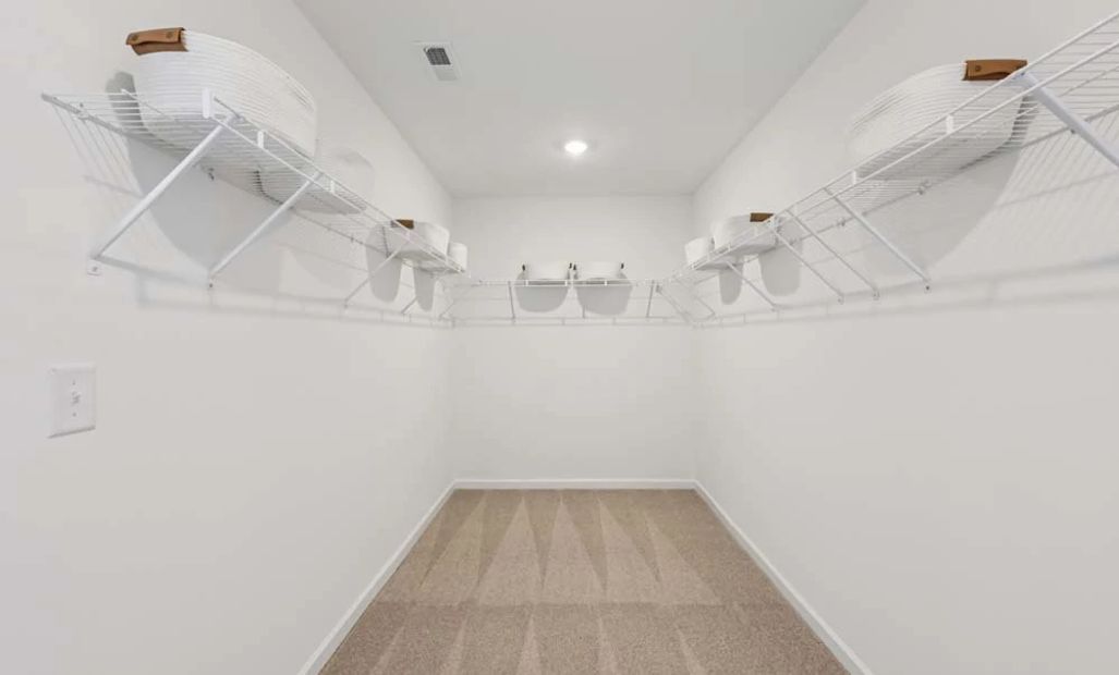 Representative Photo: Primary Bedroom Walk-In Closet