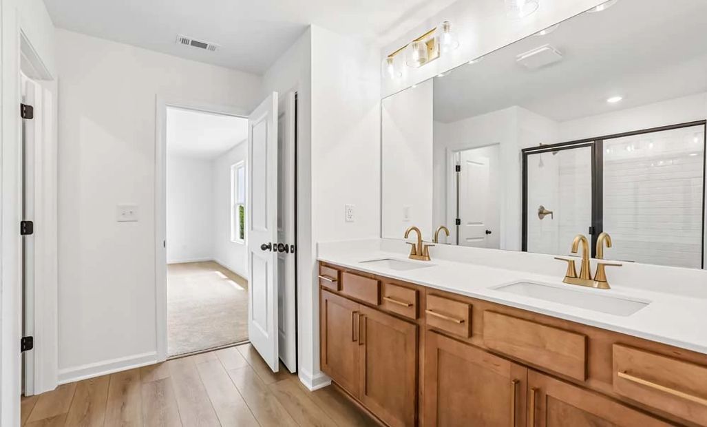 Sample Photo: Primary Bathroom featuring Laguna Collection Finishes