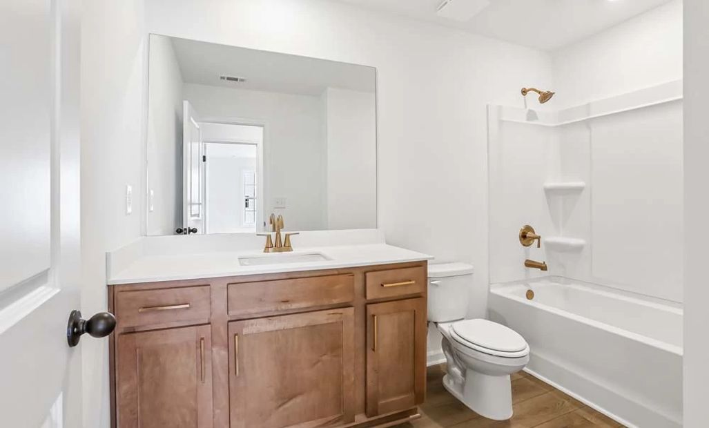 Sample Photo: Bathroom Two featuring Laguna Collection Finishes