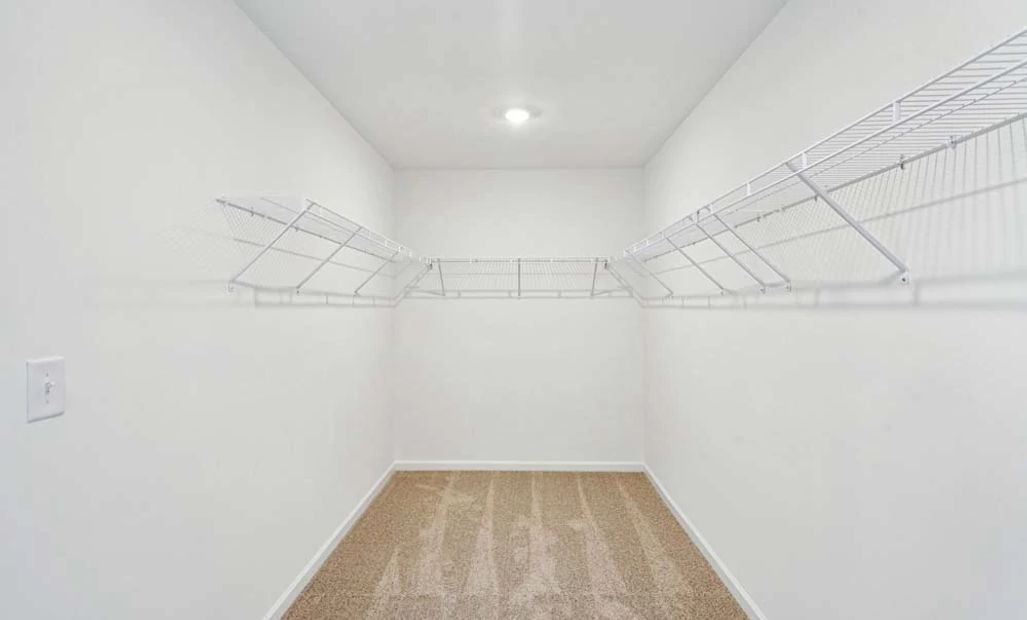Representative Photo: Primary Bedroom Walk-In Closet