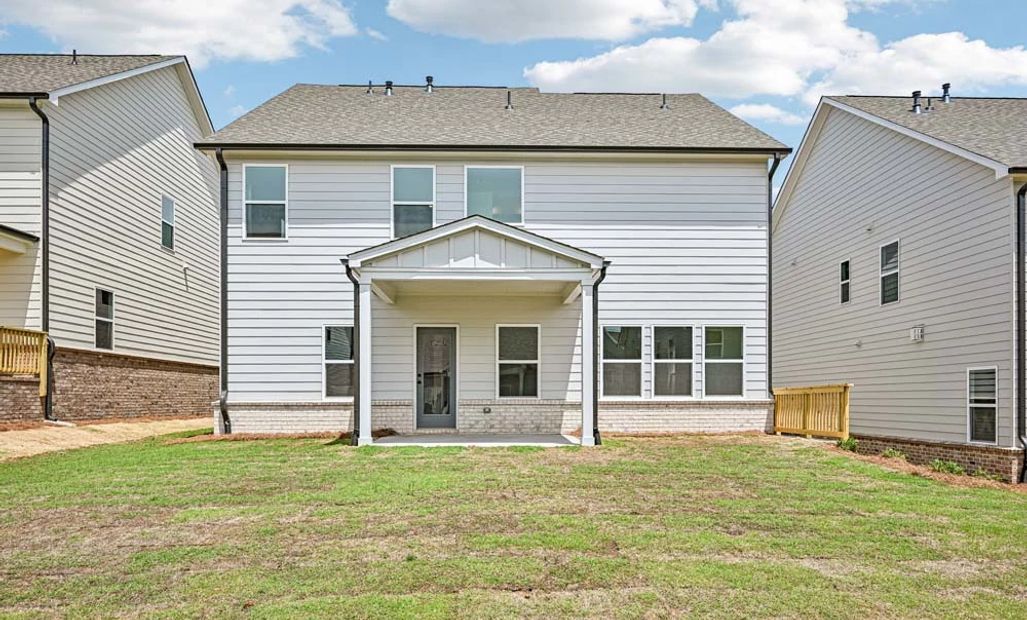 Sample Photo: Rear Exterior Featuring Covered Patio