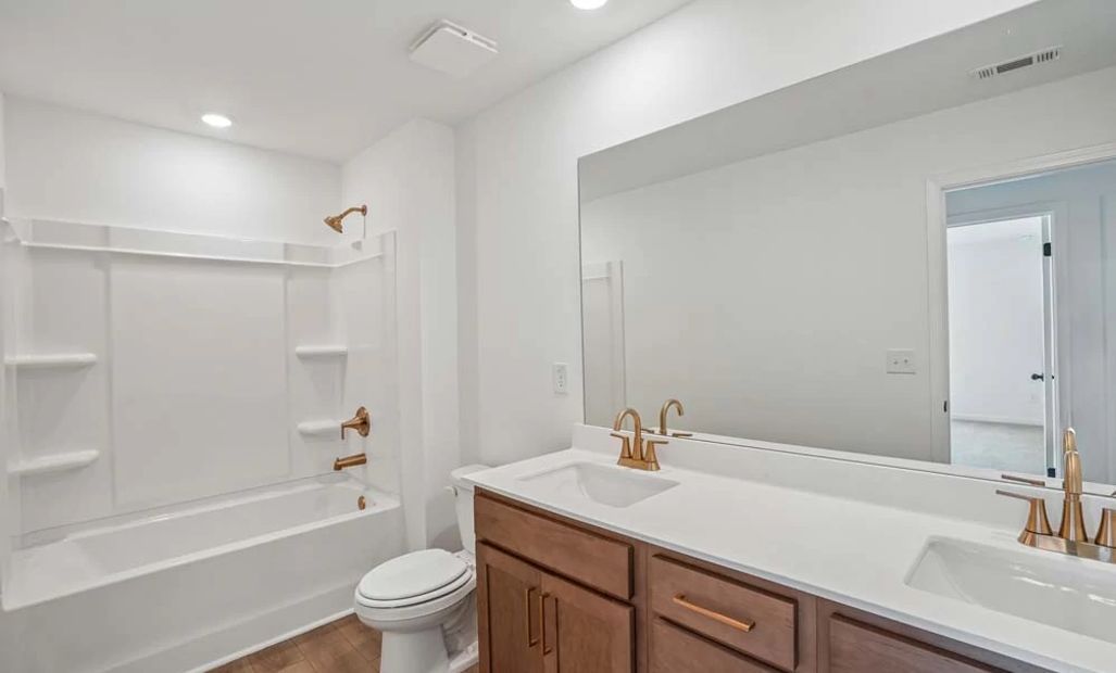 Sample Photo: Bathroom Three Featuring Laguna Collection Finishes