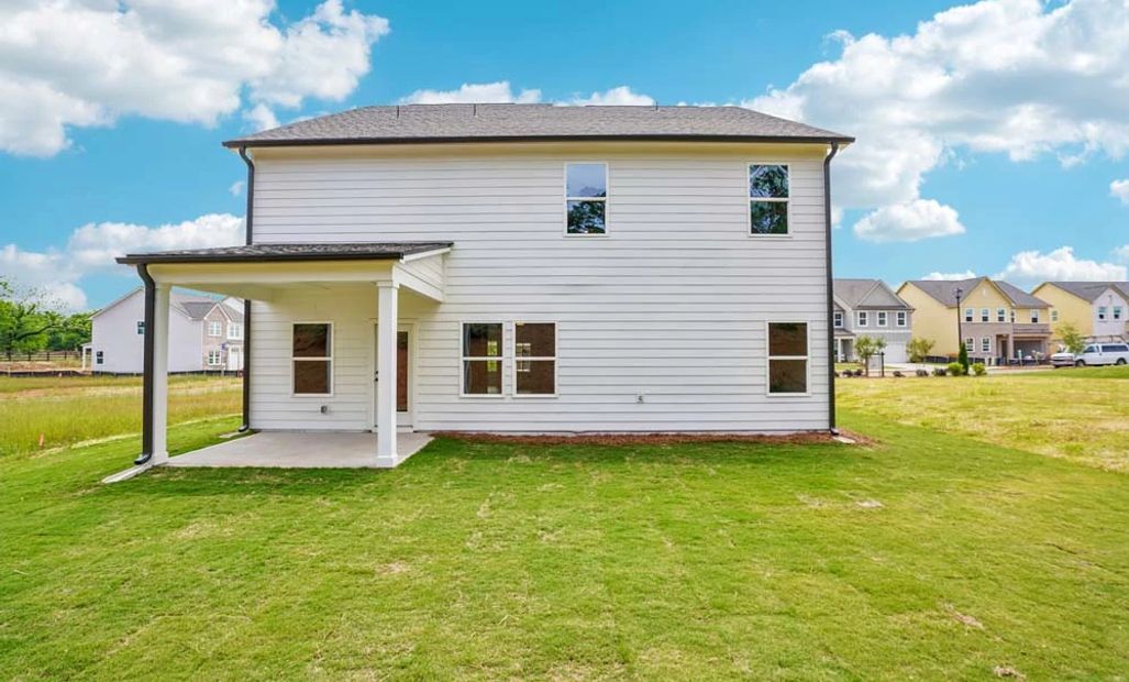 Sample Photo: Rear Exterior Featuring Covered Patio