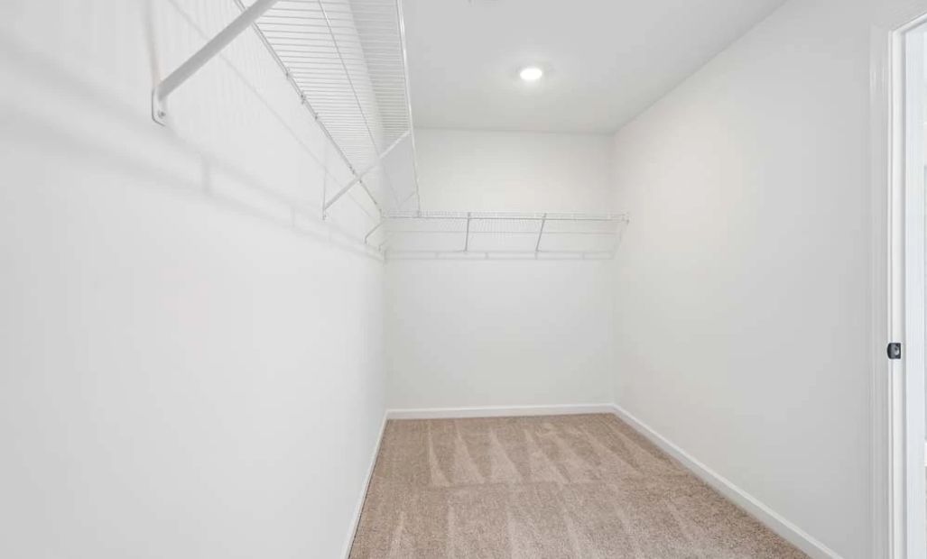 Representative Photo: Primary Bedroom Walk-In Closet