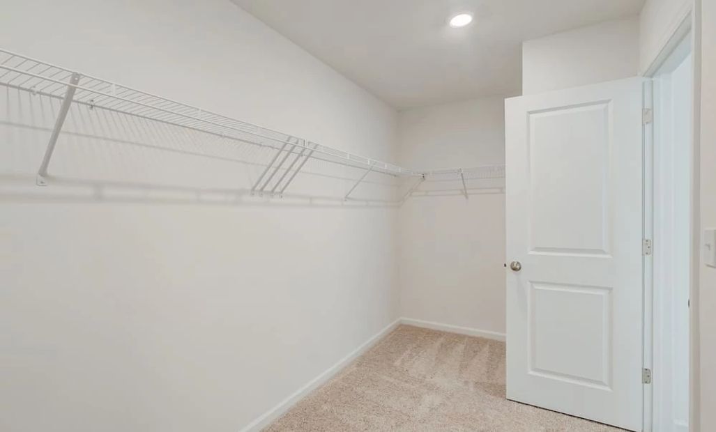 Representative Photo: Primary Bedroom Walk-In Closet