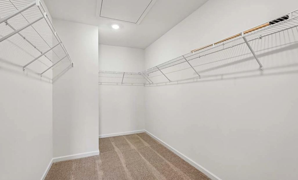 Representative Photo: Primary Bedroom Walk-In Closet