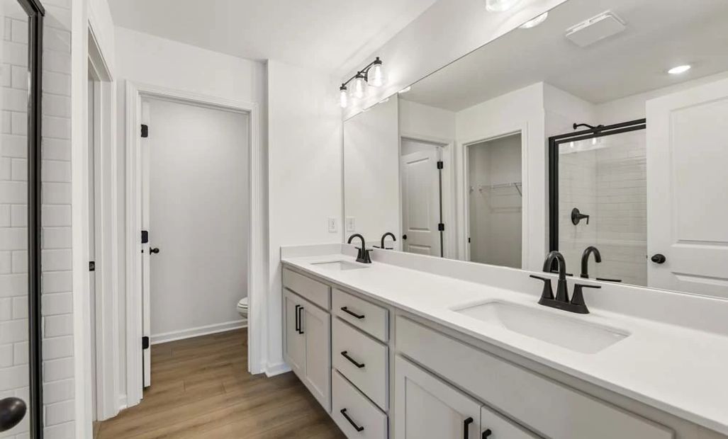 Representative Photo: Primary Bathroom featuring Artisan Collection Finishes