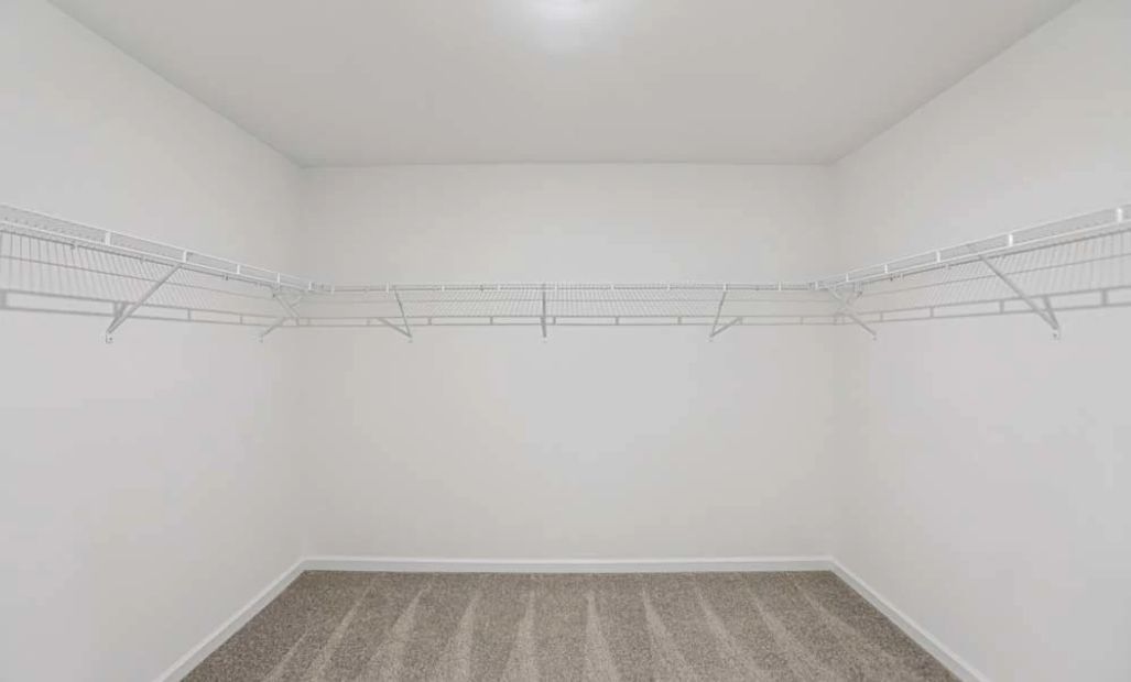 Representative Photo: Primary Bedroom Walk-In Closet