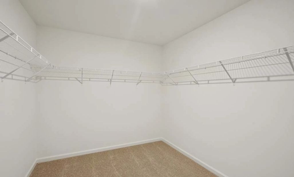 Representative Photo: Primary Bedroom Walk-In Closet