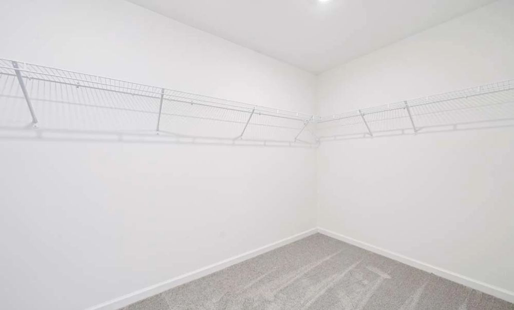 Representative Photo: Primary Bedroom Walk-in Closet