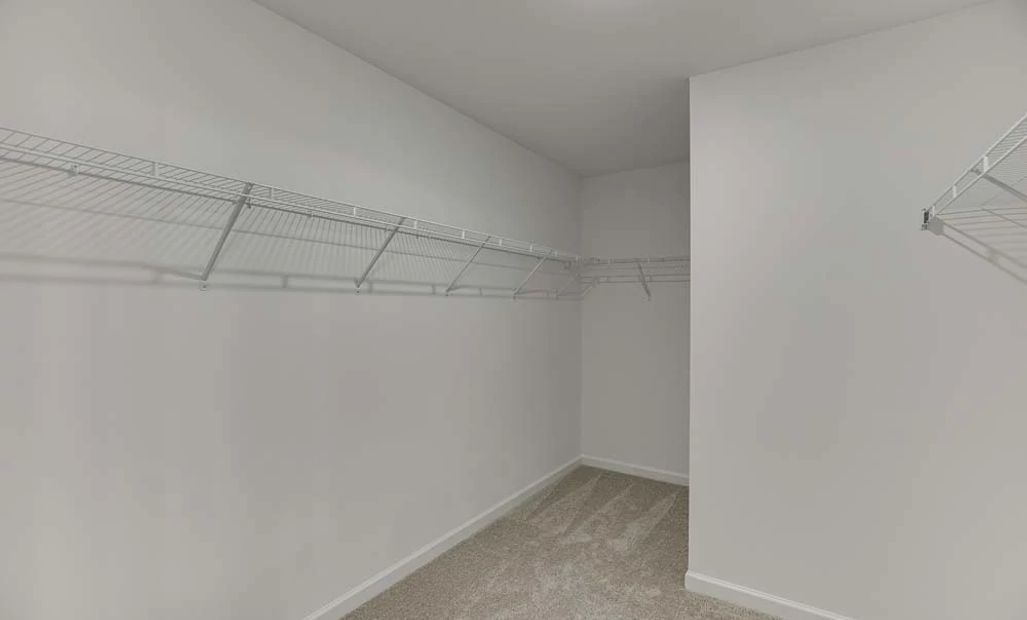Representative Photo: Primary Bedroom Walk-In Closet