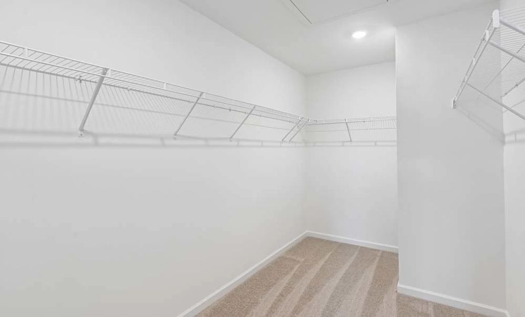 Representative Photo: Primary Bedroom Walk-In Closet