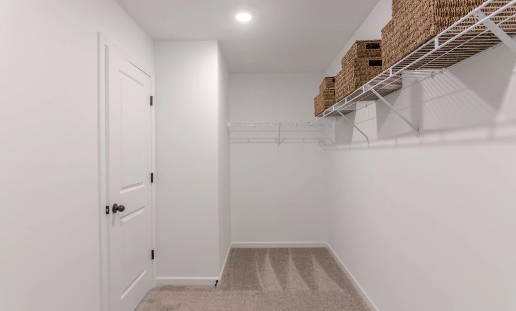 Representative Photo: Primary Bedroom Walk-In Closet