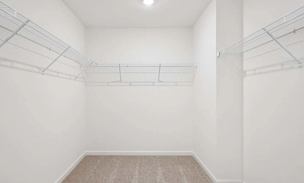 Representative Photo: Primary Bedroom Walk-In Closet