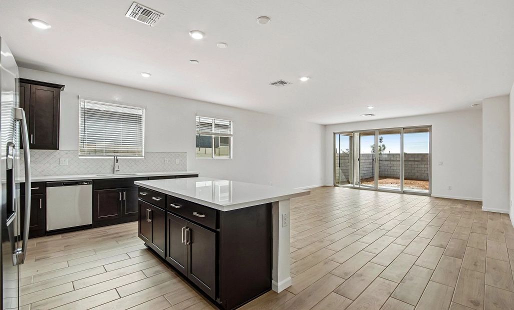 Kitchen and great room. Not actual home, finishes may vary.