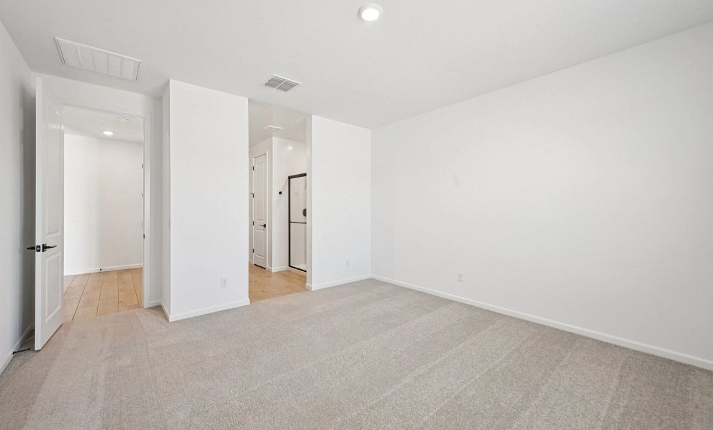 Primary suite. Not actual home, finishes may vary by community.
