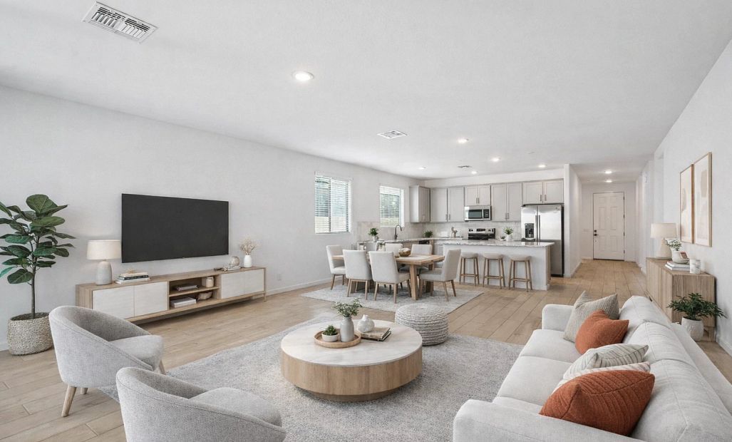 Great room and kitchen. Virtually staged. Not actual home, finishes may vary by community.