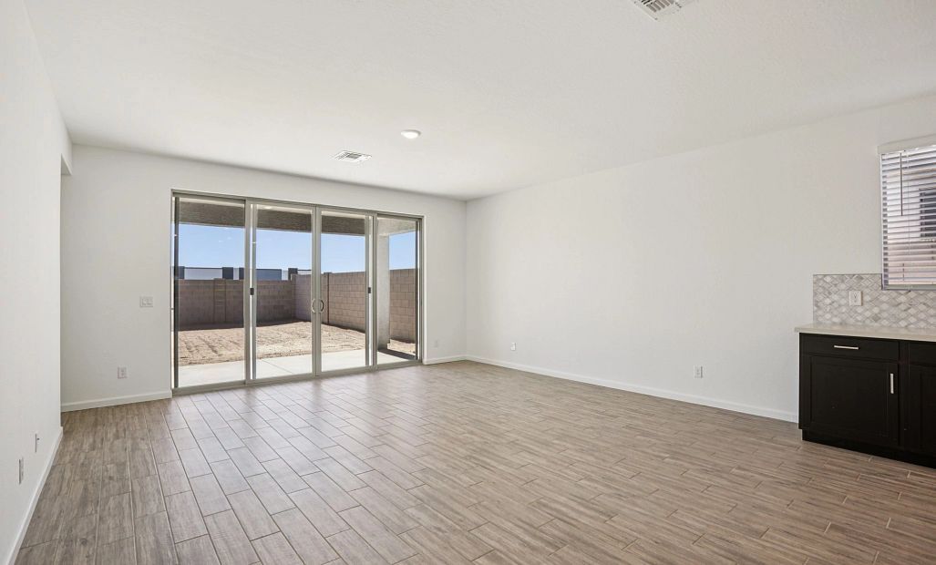 Great room with 4 panel slider. Not actual home, finishes and options may vary.