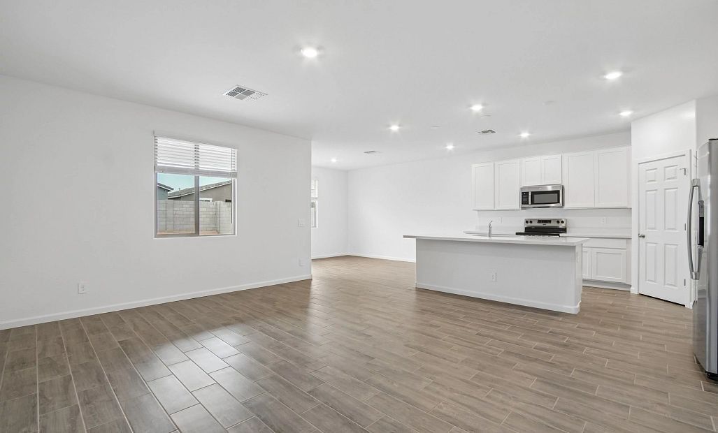 Great room, kitchen and dining. Representative images and renderings are for illustrative purposes.