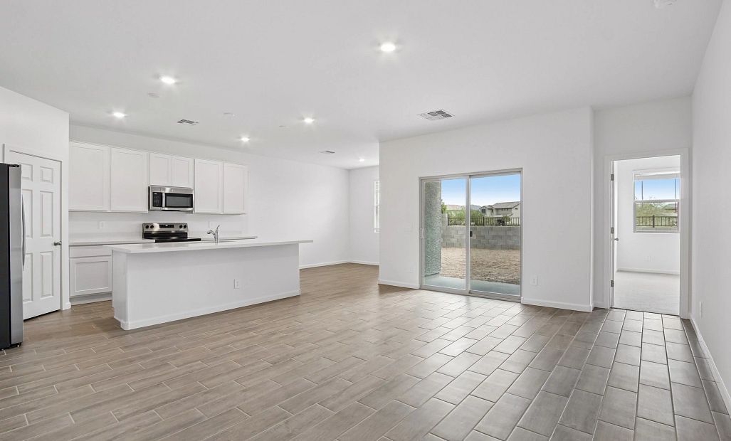 Great room, kitchen and dining. Representative images and renderings are for illustrative purposes.