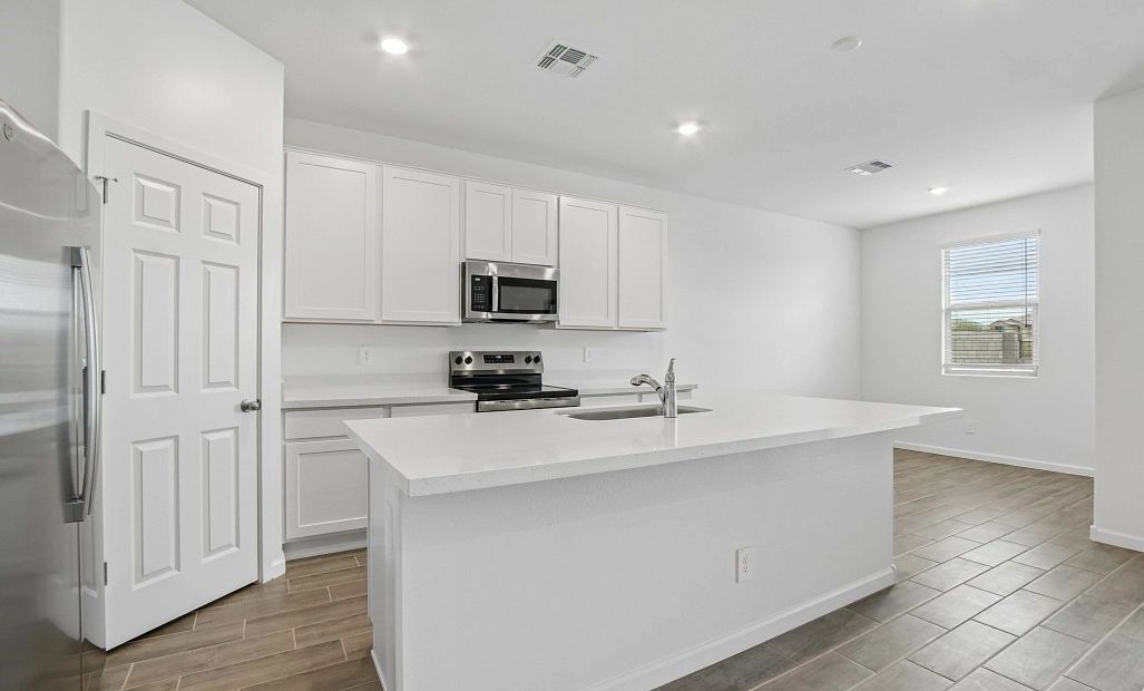 Kitchen and dining. Representative images and renderings are for illustrative purposes. Actual