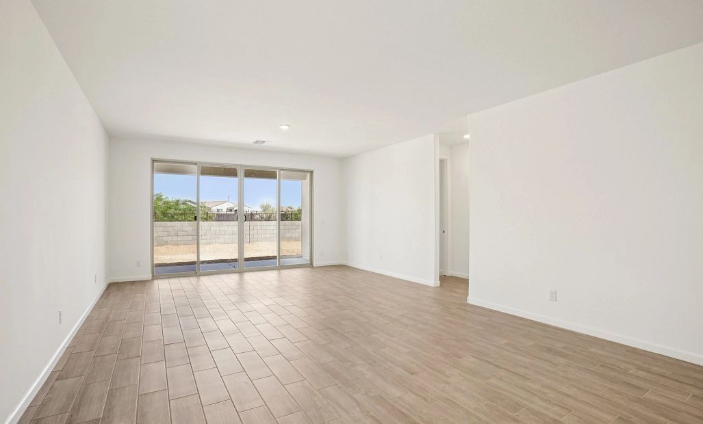 Great room with 4 panel slider. Representative images and renderings are for illustrative purposes.