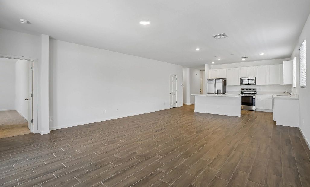 Great room and kitchen. Representative images and renderings are for illustrative purposes. Actual