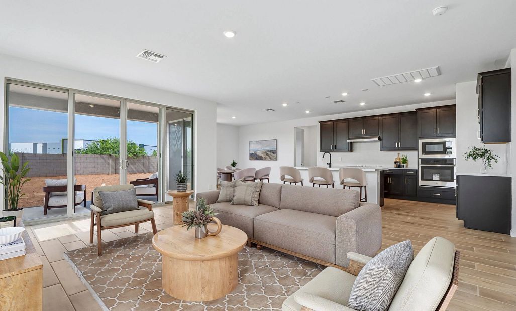 Great room, kitchen and dining. Virtually staged