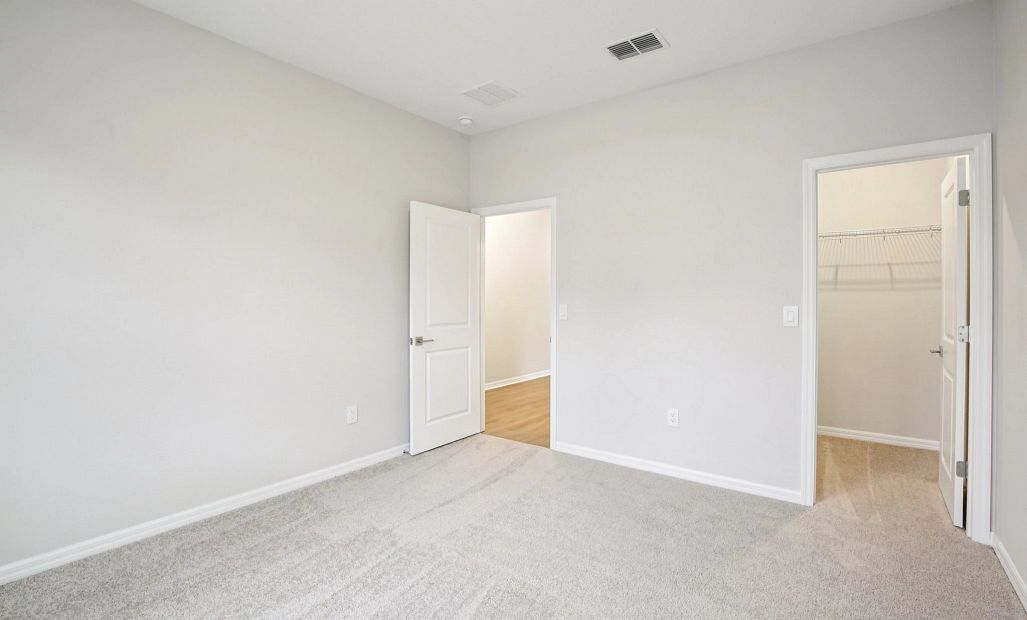 Spacious bedroom with great natural light and a walk-in closet